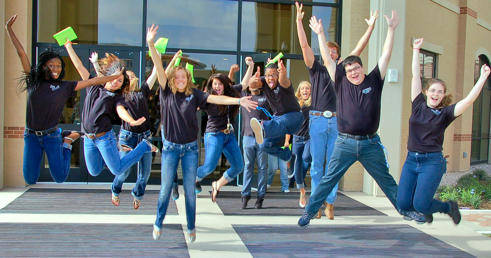 news-student-housing_15AUG14 University Students jumping in the air
